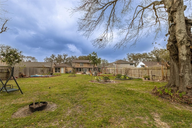 view of yard with a fenced backyard