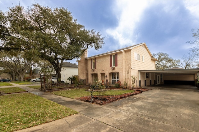 view of front facade featuring brick siding, driveway, a carport, a front lawn, and a chimney