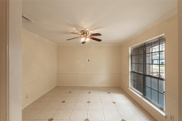 empty room with ornamental molding, light tile patterned floors, and a ceiling fan