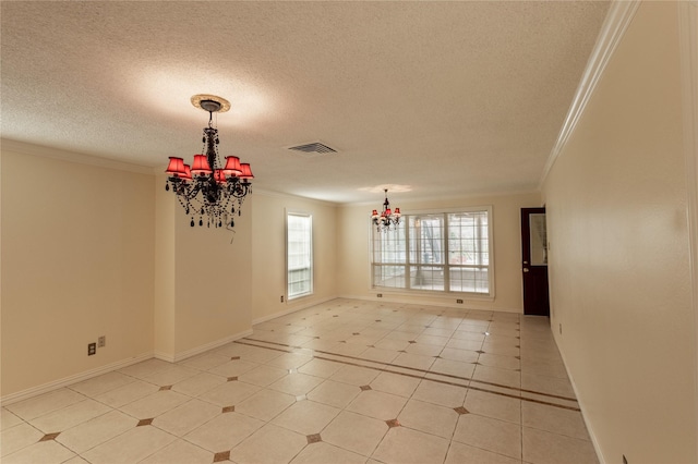 unfurnished room featuring ornamental molding, visible vents, a textured ceiling, and an inviting chandelier