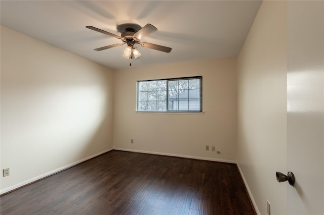 unfurnished room with dark wood-style floors, ceiling fan, and baseboards