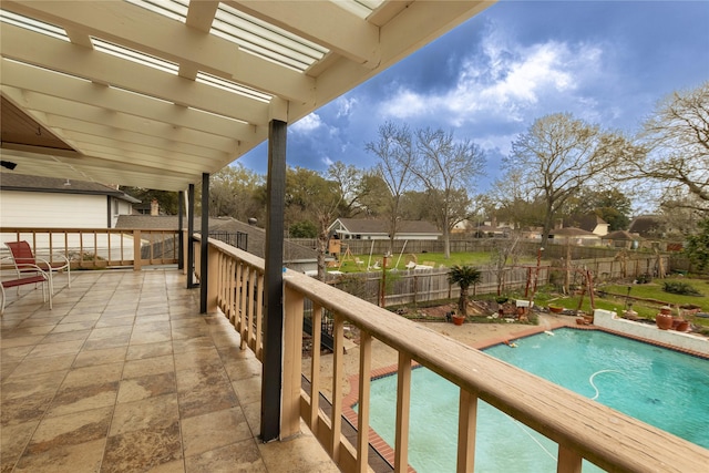 balcony featuring a pergola and a patio