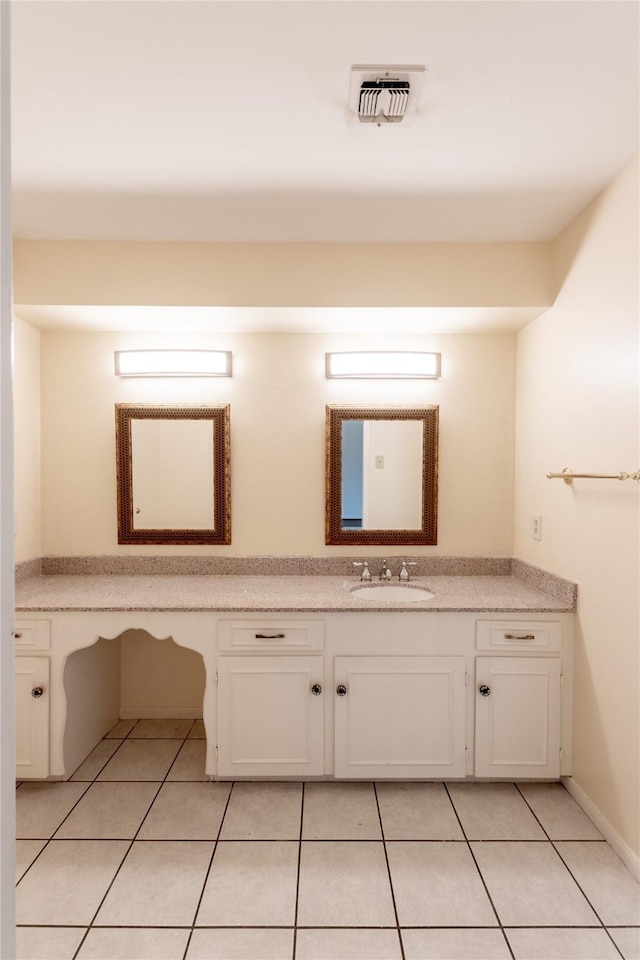 bathroom with tile patterned flooring, visible vents, and vanity