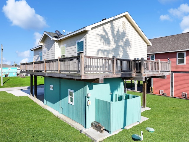 back of house with a yard and a deck