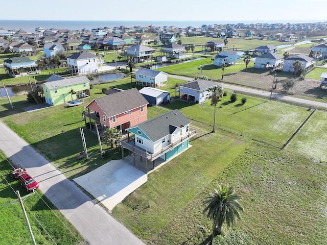 bird's eye view featuring a residential view and a water view