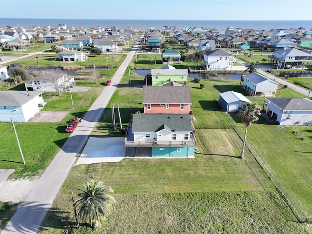 bird's eye view featuring a residential view and a water view