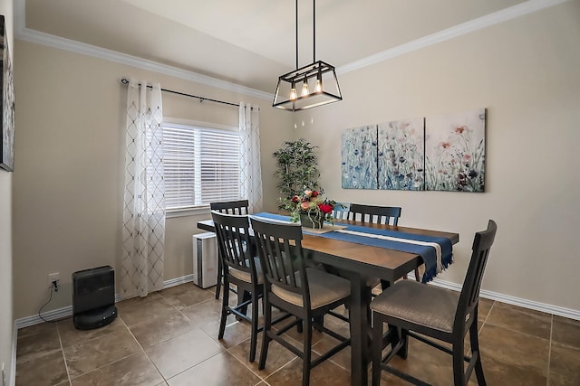 dining room featuring ornamental molding, baseboards, and tile patterned floors