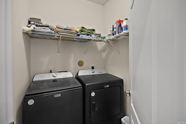 laundry area featuring laundry area and washer and clothes dryer