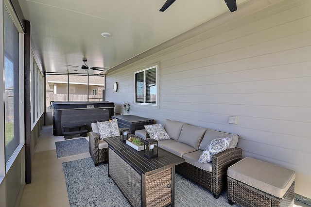 sunroom featuring ceiling fan