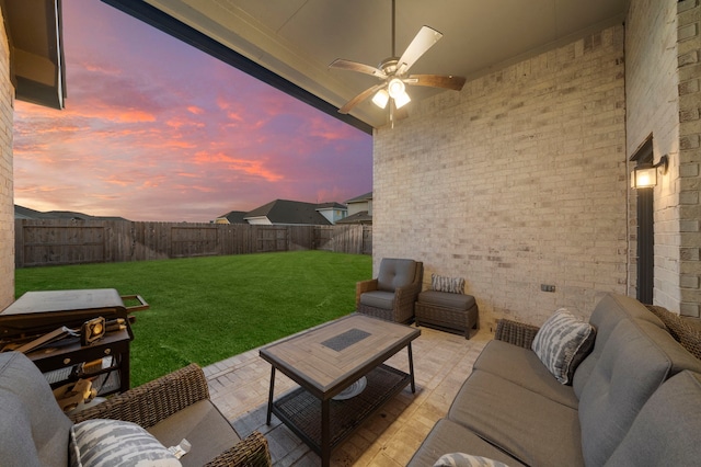 view of patio with ceiling fan, outdoor lounge area, and a fenced backyard