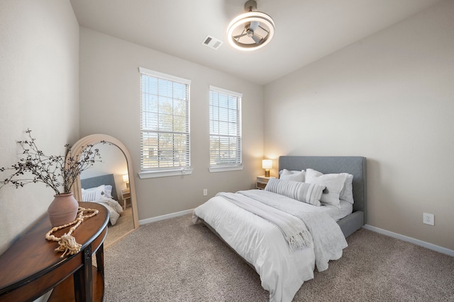 bedroom featuring carpet floors, baseboards, and visible vents