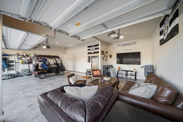 living room featuring a garage and concrete floors