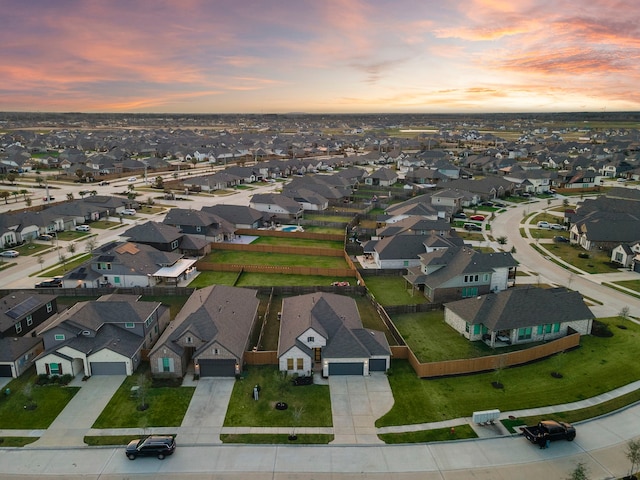 aerial view at dusk with a residential view