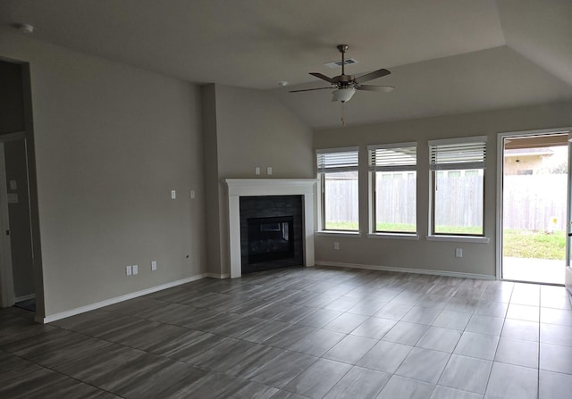 unfurnished living room with baseboards, visible vents, a ceiling fan, a tile fireplace, and lofted ceiling