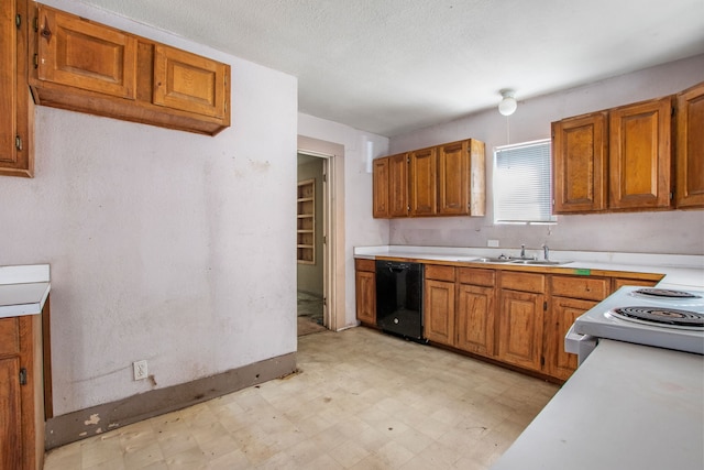 kitchen with light floors, brown cabinetry, dishwasher, and light countertops