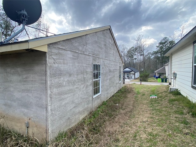 view of home's exterior with a lawn