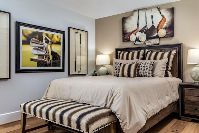 bedroom with wood finished floors