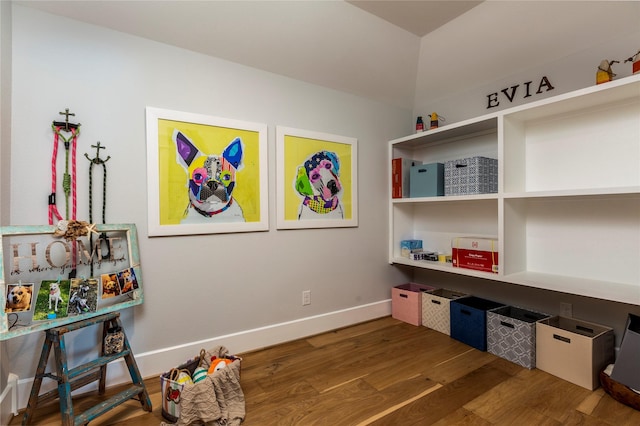 game room featuring wood finished floors and baseboards