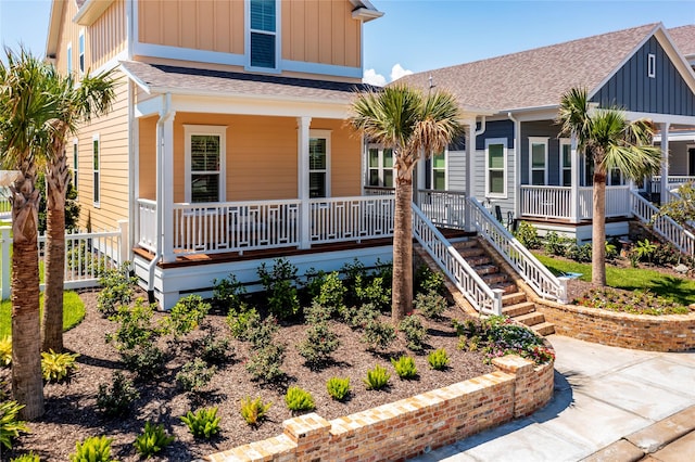 view of front of property with a porch, board and batten siding, and a shingled roof