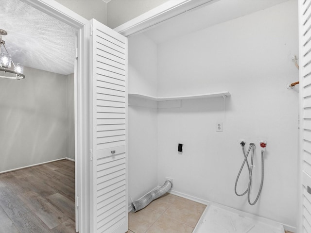 washroom featuring laundry area and hookup for an electric dryer