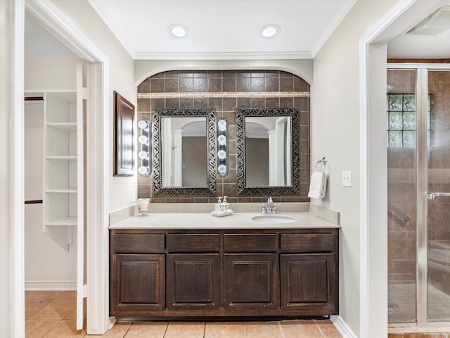 full bath featuring vanity, visible vents, a stall shower, crown molding, and tile patterned floors