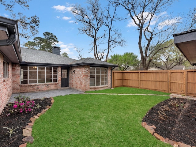 view of yard featuring a fenced backyard