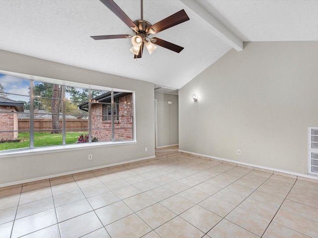 unfurnished room featuring light tile patterned floors, a ceiling fan, baseboards, lofted ceiling with beams, and a textured ceiling