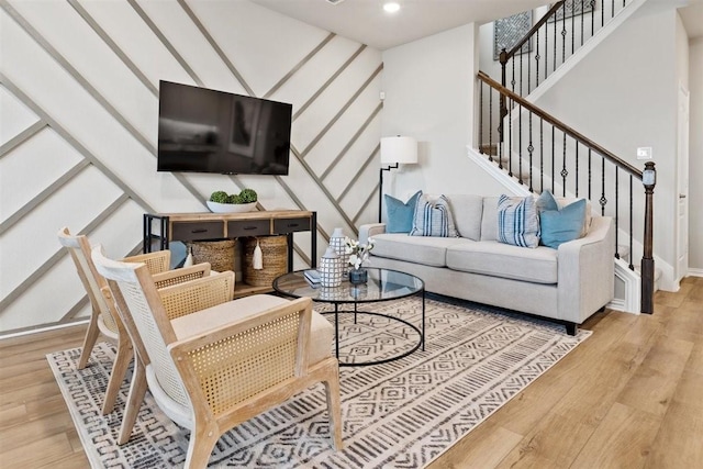 living room featuring stairway, wood finished floors, and recessed lighting