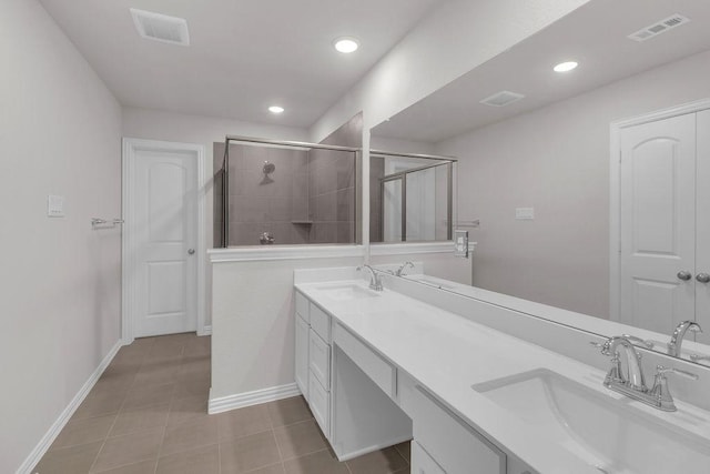 full bath featuring a shower stall, visible vents, and a sink