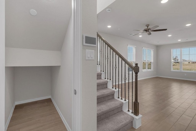 stairs featuring recessed lighting, baseboards, and wood finished floors