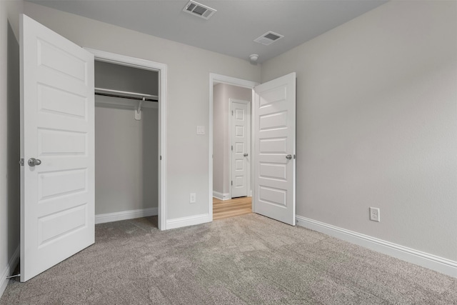 13324 Silver Egret Ln, Texas City, TX 77568 - unfurnished bedroom featuring carpet, a closet, visible vents, and baseboards