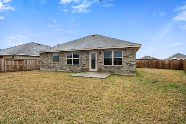 13324 Silver Egret Ln, Texas City, TX 77568 - rear view of property featuring a yard, brick siding, and a patio