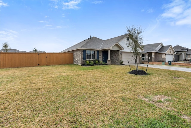 13324 Silver Egret Ln, Texas City, TX 77568 - view of front of house featuring a garage, concrete driveway, fence, a front lawn, and brick siding