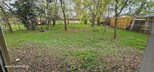 view of yard with a fenced backyard