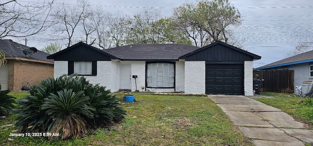 ranch-style house featuring an attached garage, brick siding, fence, driveway, and a front lawn