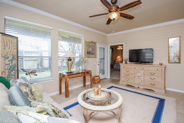 living area featuring ornamental molding, light tile patterned flooring, ceiling fan, and baseboards