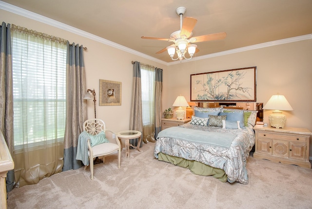 bedroom featuring a ceiling fan, light colored carpet, and crown molding