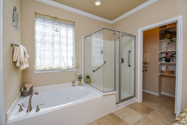 bathroom with a stall shower, crown molding, and a bath