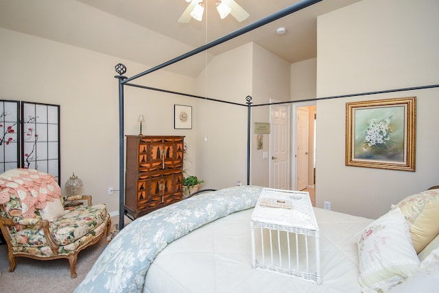 bedroom with lofted ceiling, ceiling fan, and carpet flooring