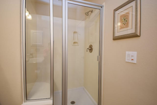 bathroom with a stall shower