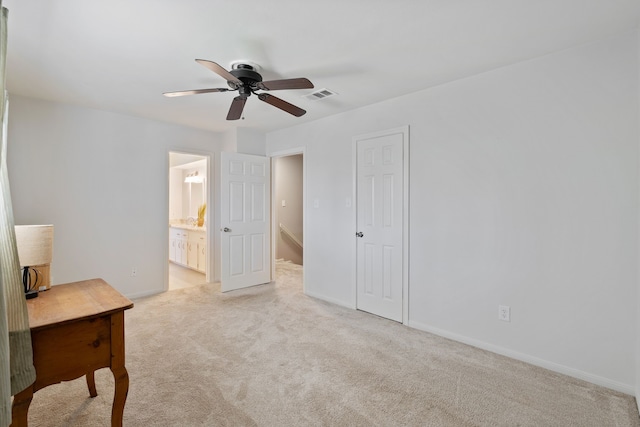 unfurnished bedroom featuring visible vents, ceiling fan, baseboards, carpet floors, and ensuite bathroom