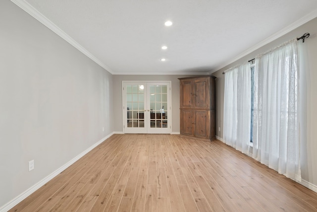 unfurnished room featuring baseboards, light wood finished floors, recessed lighting, french doors, and crown molding