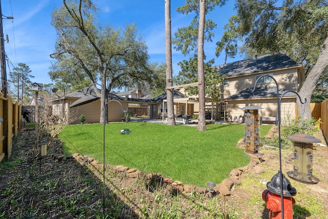 view of yard with a patio and a fenced backyard