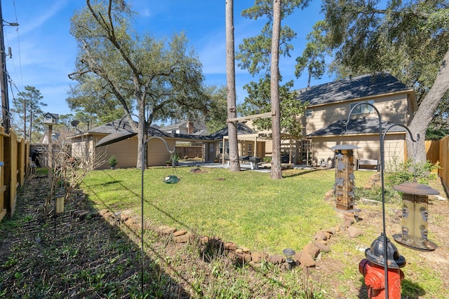 view of yard with a patio and a fenced backyard