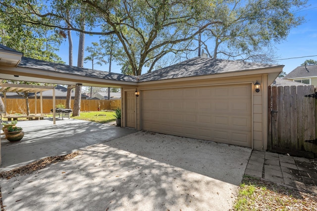 garage featuring fence