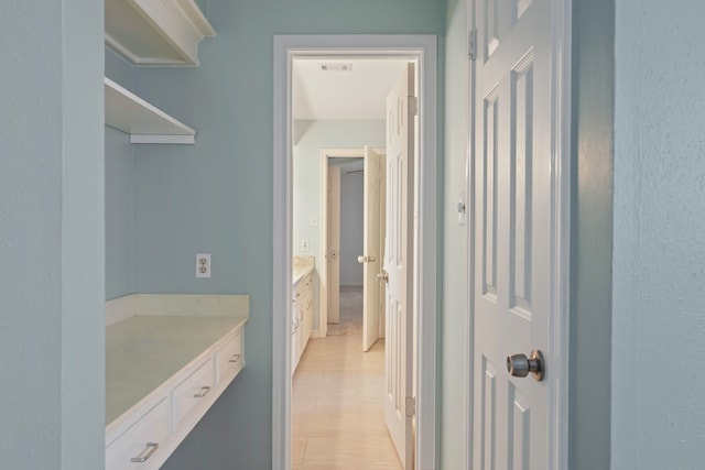 bathroom with visible vents, wood finished floors, and vanity