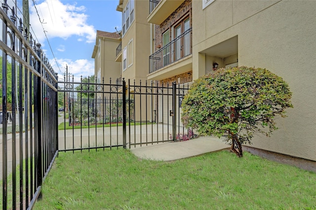 view of gate with fence