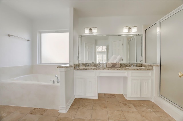 full bathroom featuring a stall shower, a garden tub, a sink, and double vanity