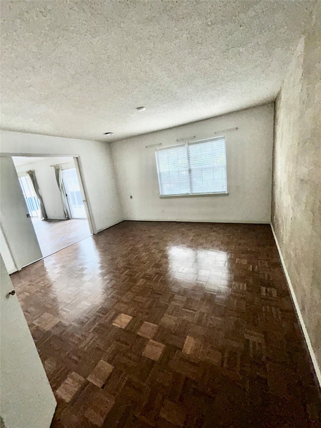 empty room featuring a textured ceiling