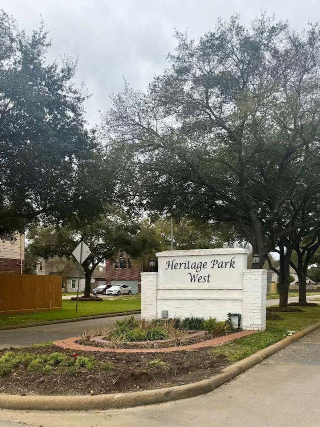 community sign with fence